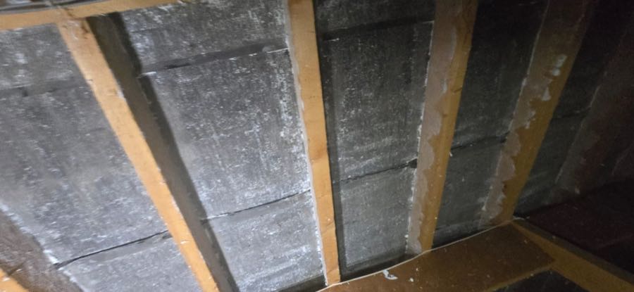 Loft insulation and roof felt exposed after spray foam removal