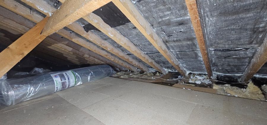 Spray foam insulation removed from roof rafters by MG SOURCE